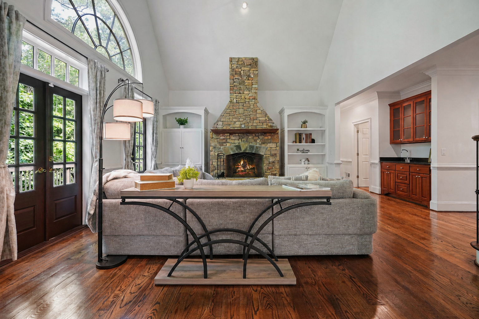 Vaulted living room with stone fireplace at 10470 Stanyan St